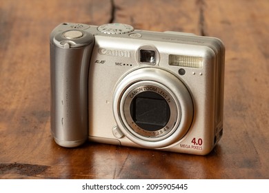 Old Canon Camera On A Wooden Background. Old Digital Camera. 