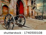 Old canons guarding the main gate to the historical Ramnagar Fort in Varanasi, India