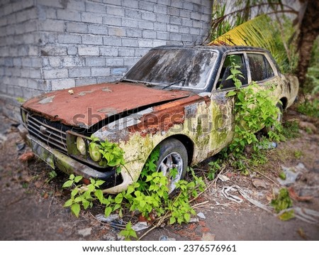 an old car abandoned to rust