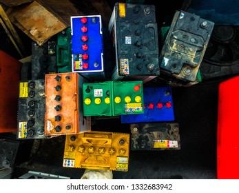 Old Car Battery, A Pallet Holds Several Batteries Awaiting Recycling At A Metal Recycling Scrap Yard.