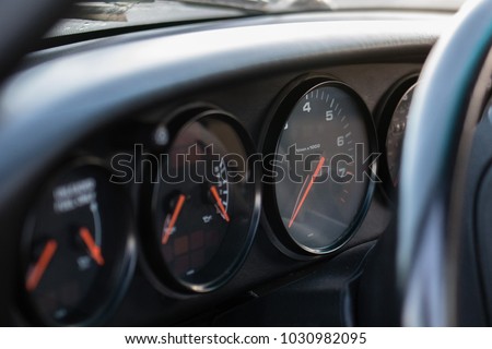Old car dashboard with gauges driving vintage Porsche