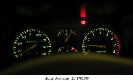 Old Car Dashboard With The Lights On