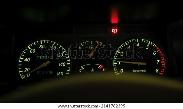 old car dashboard with\
the lights on