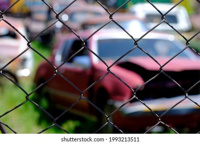 Old car dump filled with wrecked cars broken glass parts - Shutterstock ID 1993213511