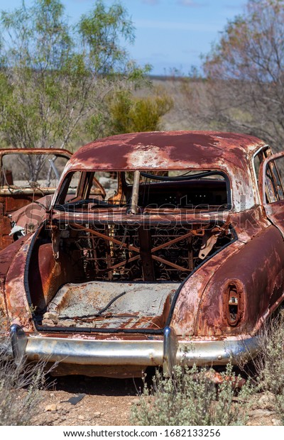 Old car graveyard of cars that\
have broken down crossing the Nullarbor Plain, Western\
Australia