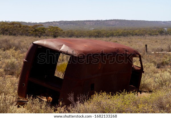 Old car graveyard of cars that\
have broken down crossing the Nullarbor Plain, Western\
Australia