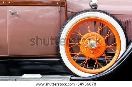 Old car with orange tire profile