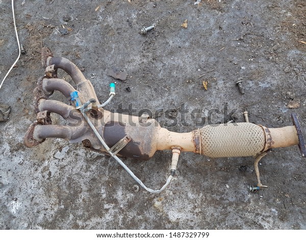 Old car parts. Exhaust, pipe manifold of vehicle\
exhaust gas.