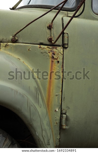 Old car, rusty\
car, texture, abandoned car, rusty hood, rusty car doors, rusty\
metal, peeling paint, GAZ
