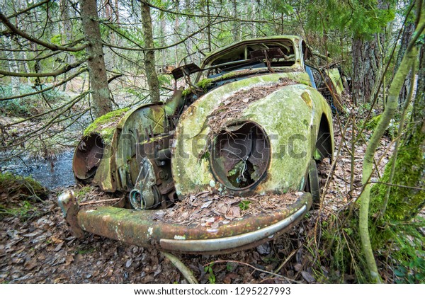Old car scrap in\
forest