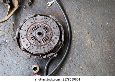 Old Car Spare Part On Dirty Garage Floor, Damaged Car Spare Part