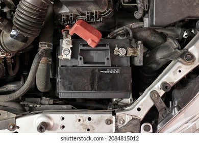 Old Car Starter Battery Inside The Engine Bay Viewed From Above Top Down