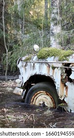 Old Car Stuck In The Frozen  Flood In The Forest At Southern Finland.