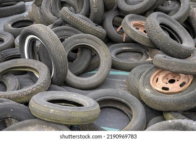 Old Car Tires And Rims In A Big Pile In The Netherlands
