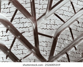 Old car tires stacked in a row at a tire shop, closeup of photo - Powered by Shutterstock