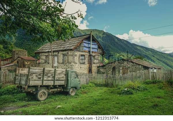 Old Car, Truck in a\
mountain village