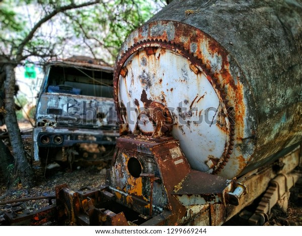 Old car wrecks\
parked in the car graveyard