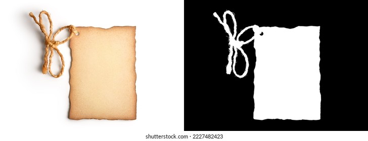 Old cardboard label with worn edges and a rope tied in the shape of a bow isolated on white background with clipping path or alpha channel