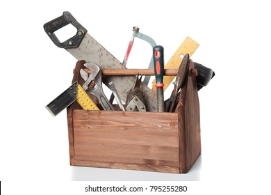 Old Carpenter Wooden toolbox with tools isolated on white.