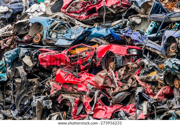old cars were scrapped in a trash\
compactor. scrap iron and scrapping premium for car\
wrecks