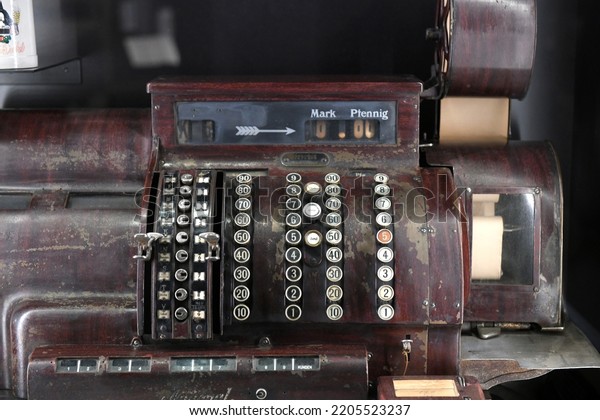 Old cash register with old German currency D-Mark\
and Pfennig