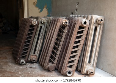 Old Cast Iron Radioators At The Wall. Renovation And Reconstruction Of Heating System