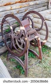 An Old Cast Iron Straw Chopper In The Courtyard Of An Old Village House