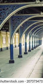 An Old Cast Metal Trainshed (debarcadere) Above The Railway Landing Platform At The Station. Evenly Spaced Columns And An Example Of A Linear Perspective