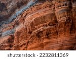 The “Altschlossfelsen“ or "Old Castle Rocks" is a rock outcrop formed of bunter sandstone in the Palatine Forest of Germany, near the border with France. Colorful layers in shades of grey, brown, red.