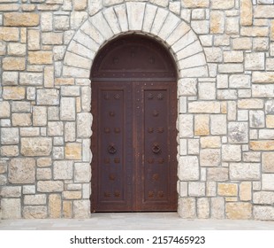 Old Castle Stone Wall With Closed Big Metal Doors. Vintage Gates. Retro Doors, Rock Castle. Ancient Concept