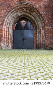 Old Castle Stone Wall With Closed Big Metal Doors. Vintage Gates. Retro Doors, Rock Castle.