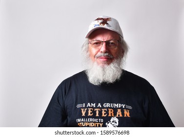 Old Caucasian male veteran looking pained and angry.
  
  
