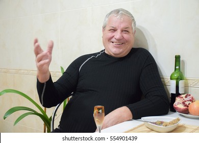 Old Caucasian Man Drinking Wine At Home