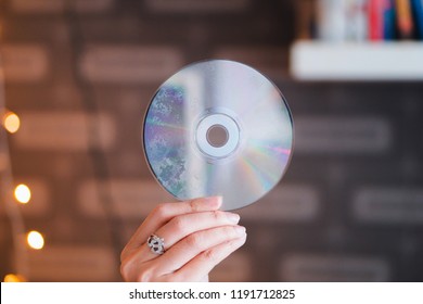 Old CD In The Women's Hand.
