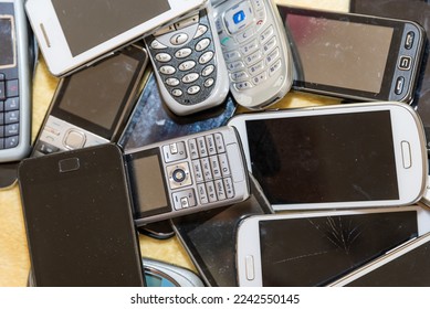 Old cell phone collection - recycling of valuable raw materials from smartphones - Shutterstock ID 2242550145