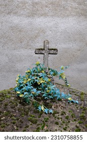 old cemetery with grave and flowers - Shutterstock ID 2310758855