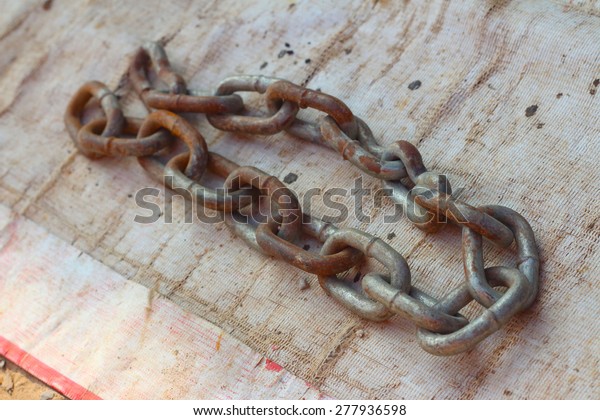 old chain for car on\
white background. 
