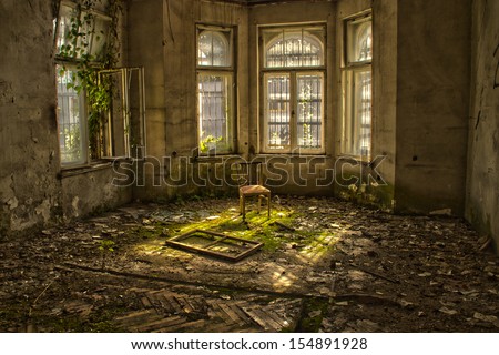 Old chair in an abandoned dilapidated house