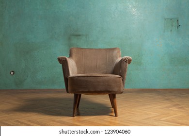 Old Chair In Grunge Room With Green Wall