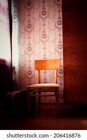 the old chair rubbed from time costs in the room - Shutterstock ID 206416876