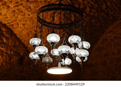 An Old Chandelier With Antique Lamps.