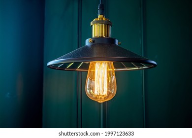 Old chandelier in yellow background and minimal style