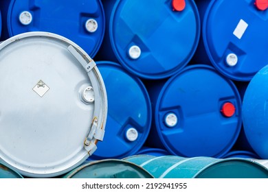 Old Chemical Barrels. Blue And Green Oil Drum. Steel And Plastic Oil Tank. Toxic Waste Warehouse. Hazard Chemical Barrel With Warning Label. Industrial Waste In Drum. Hazard Waste Storage In Factory. 