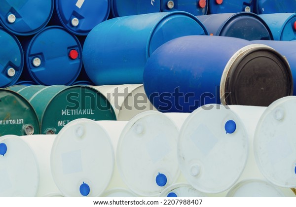 Old chemical barrels. Stack of methanol or methyl\
alcohol drum. Steel chemical tank. Toxic waste. Plastic and steel\
chemical barrels. Industrial waste in drum. Hazard waste storage at\
factory yard.