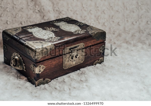 old chest with brass\
plates. tint