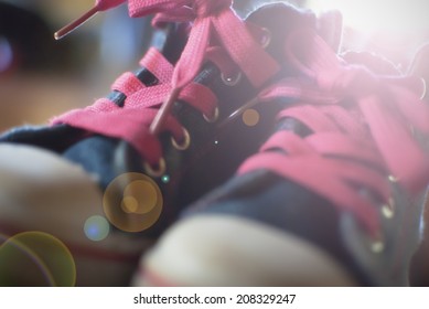 Old Children's Sport Shoes With Blurred Background