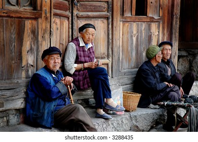 old chinese men and women socializing on the street