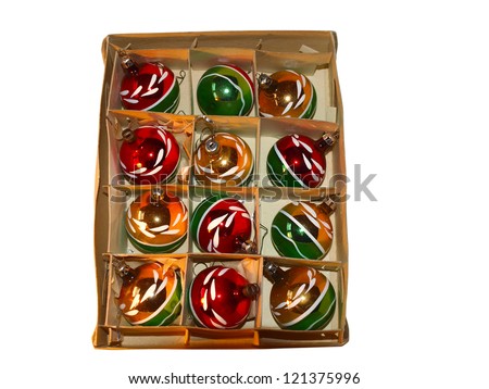 Christmas balls in box on rustic wooden background