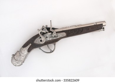 Old Chrome Pistol On White Background