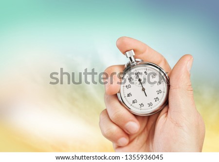 old chronometer in hand